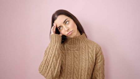 Photo for Young beautiful hispanic woman stressed standing over isolated pink background - Royalty Free Image
