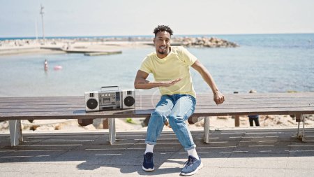 Photo for African american man smiling confident dancing at seaside - Royalty Free Image