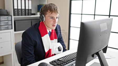 Photo for Young caucasian man business worker supporting soccer team at office - Royalty Free Image