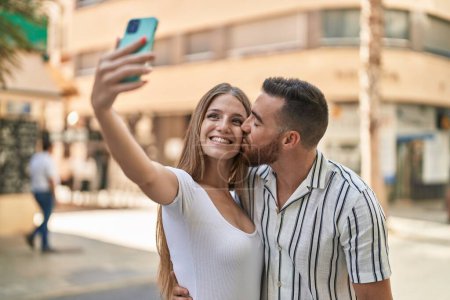 Photo for Man and woman couple smiling confident make selfie by smartphone at street - Royalty Free Image