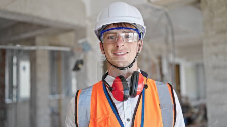 Photo for Young caucasian man architect smiling confident standing at construction site - Royalty Free Image