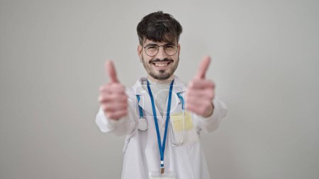 Photo for Young hispanic man doctor doing thumbs up over isolated white background - Royalty Free Image