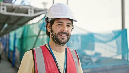 Photo for Young hispanic man builder smiling confident standing at street - Royalty Free Image