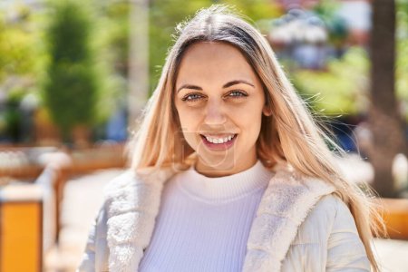 Photo for Young woman smiling confident standing at park - Royalty Free Image