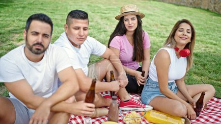 Photo for Group of people smiling confident having picnic at park - Royalty Free Image
