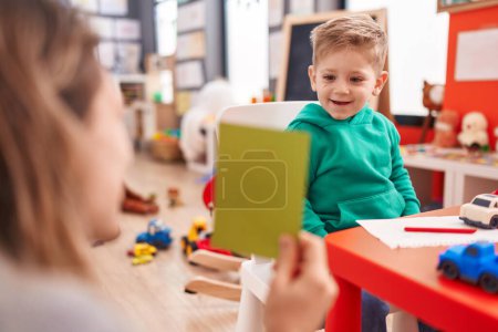 Photo for Adorable caucasian boy having vocabulary lesson at kindergarten - Royalty Free Image