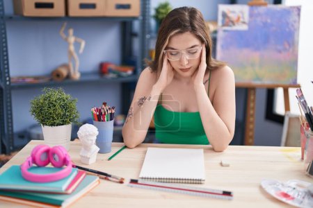 Photo for Young woman artist stressed drawing at art studio - Royalty Free Image