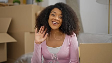 Photo for African american woman smiling confident speaking at new home - Royalty Free Image