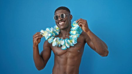 Photo for African american man tourist standing shirtless dancing over isolated blue background - Royalty Free Image