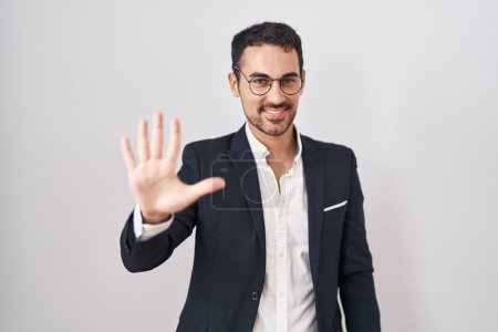 Photo for Handsome business hispanic man standing over white background showing and pointing up with fingers number five while smiling confident and happy. - Royalty Free Image