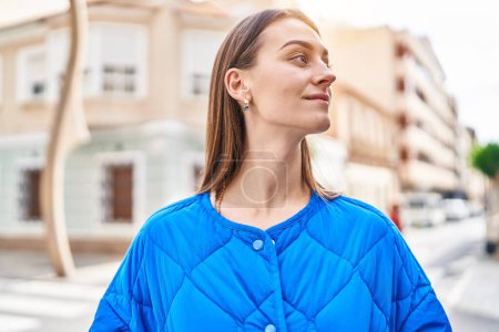 Photo for Young caucasian woman smiling confident looking to the side at street - Royalty Free Image