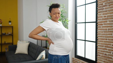 Photo for Young pregnant woman suffering for backache at home - Royalty Free Image