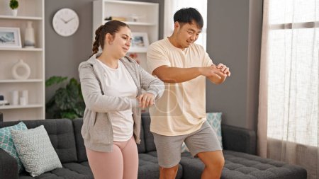 Photo for Man and woman couple smiling confident training at home - Royalty Free Image