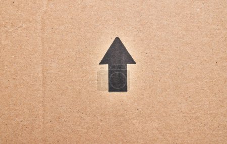 Photo for Brown cardboard carton material with arrow texture background - Royalty Free Image