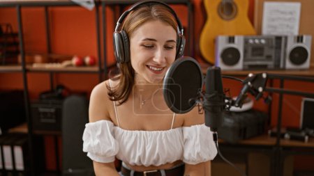 Photo for Young woman radio reporter working speaking at radio studio - Royalty Free Image