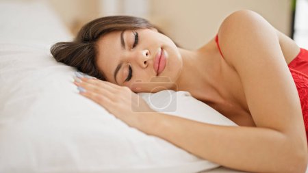 Photo for Young caucasian woman wearing body lingerie lying on bed sleeping at bedroom - Royalty Free Image