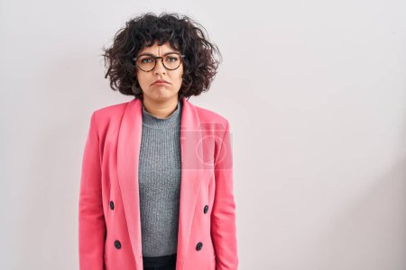 Photo for Hispanic woman with curly hair standing over isolated background depressed and worry for distress, crying angry and afraid. sad expression. - Royalty Free Image