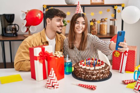 Photo for Mand and woman couple celebrate birthday make selfie by smartphone at home - Royalty Free Image
