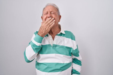 Photo for Senior man with grey hair standing over white background bored yawning tired covering mouth with hand. restless and sleepiness. - Royalty Free Image