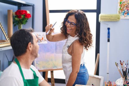 Photo for Man and woman artists smiling confident drawing at art studio - Royalty Free Image