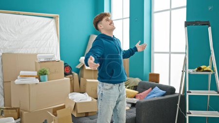 Photo for Young hispanic man smiling confident looking around at new home - Royalty Free Image