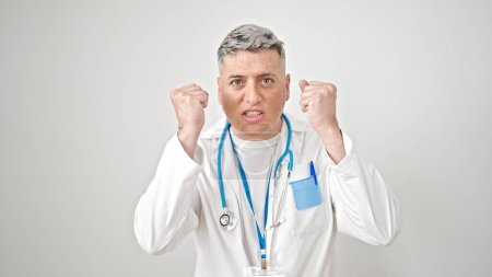 Photo for Young caucasian man doctor angry and stressed over isolated white background - Royalty Free Image