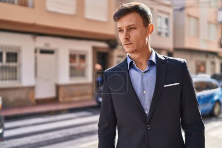 Photo for Young man business worker standing with relaxed expression at street - Royalty Free Image