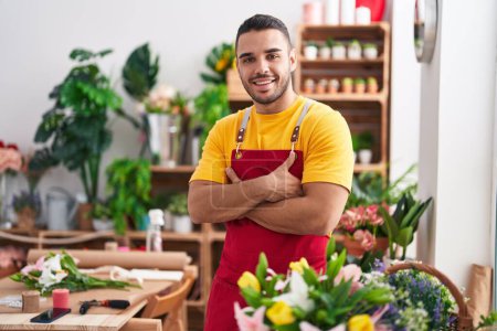 Photo for Young hispanic man florist smiling confident standing with arms crossed gesture at florist - Royalty Free Image