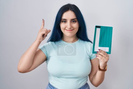 Photo for Young modern girl with blue hair holding l sign for new driver surprised with an idea or question pointing finger with happy face, number one - Royalty Free Image