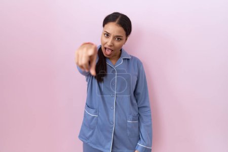 Photo for Young arab woman wearing blue pajama pointing displeased and frustrated to the camera, angry and furious with you - Royalty Free Image