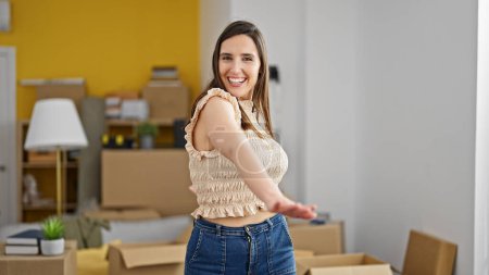 Photo for Young beautiful hispanic woman smiling confident standing at new home - Royalty Free Image