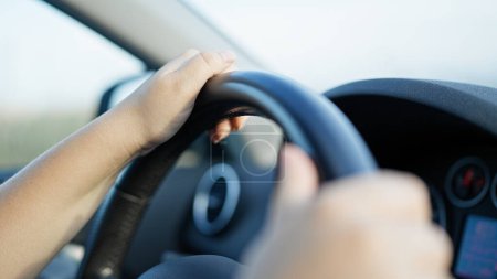 Photo for Young beautiful hispanic woman driving a car on the road - Royalty Free Image