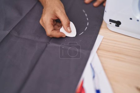 Photo for Middle age grey-haired woman tailor make mark on cloth at tailor shop - Royalty Free Image
