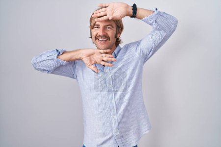 Photo for Caucasian man with mustache standing over white background smiling cheerful playing peek a boo with hands showing face. surprised and exited - Royalty Free Image