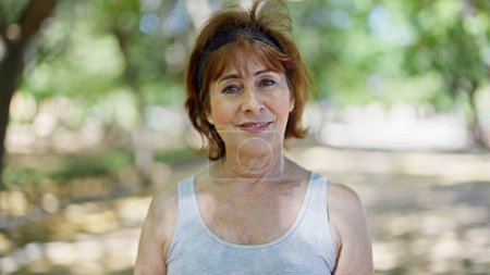 Photo for Middle age woman smiling confident standing at park - Royalty Free Image