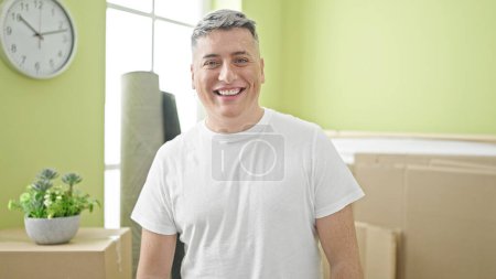 Photo for Young caucasian man smiling confident standing at new home - Royalty Free Image