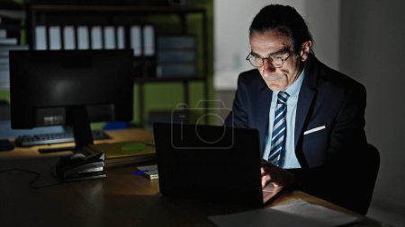 Photo for Middle age man business worker using laptop working at the office - Royalty Free Image