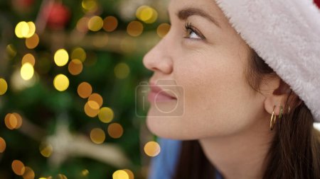 Photo for Young caucasian woman wearing christmas hat smiling confident at home - Royalty Free Image