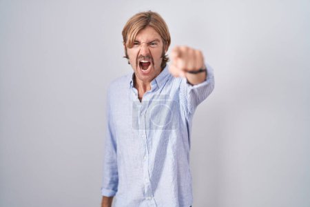 Photo for Caucasian man with mustache standing over white background pointing displeased and frustrated to the camera, angry and furious with you - Royalty Free Image