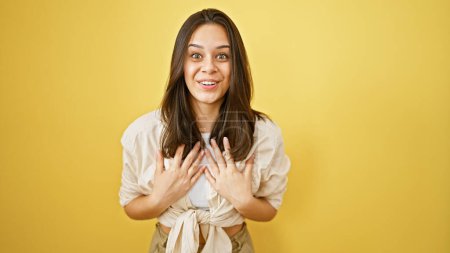 Photo for Young beautiful hispanic woman smiling confident standing surprised over isolated yellow background - Royalty Free Image
