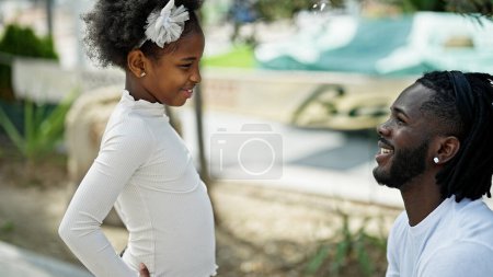 Photo for African american father and daughter smiling confident standing together at park - Royalty Free Image
