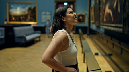 Photo for Young beautiful hispanic woman visiting art gallery at Art Museum in Vienna - Royalty Free Image