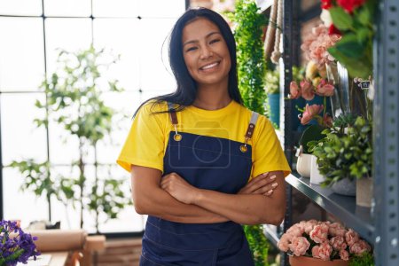 Photo for Young beautiful latin woman florist smiling confident standing with arms crossed gesture at florist - Royalty Free Image
