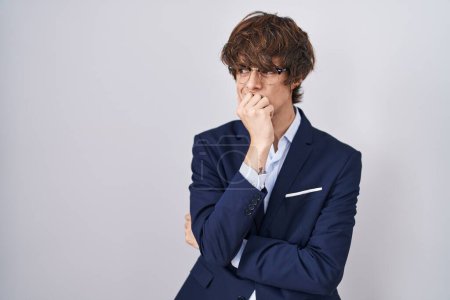 Photo for Hispanic business young man wearing glasses looking stressed and nervous with hands on mouth biting nails. anxiety problem. - Royalty Free Image