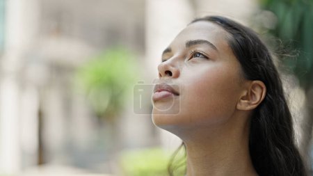 Photo for African american woman looking to the sky breathing at street - Royalty Free Image