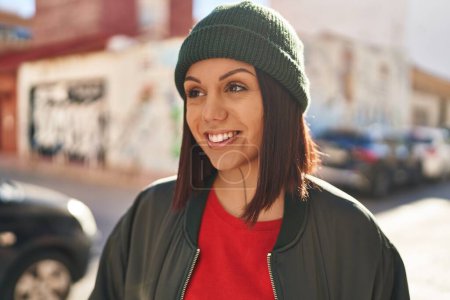 Photo for Young beautiful hispanic woman smiling confident looking to the side at street - Royalty Free Image