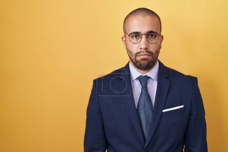 Photo for Hispanic man with beard wearing suit and tie depressed and worry for distress, crying angry and afraid. sad expression. - Royalty Free Image