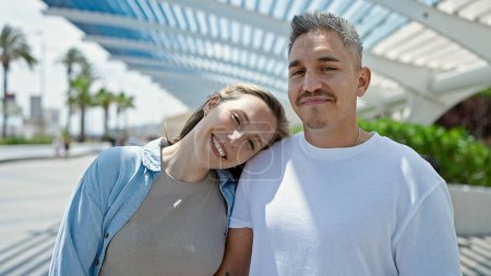 Foto de Man and woman couple smiling confident standing together at park - Imagen libre de derechos