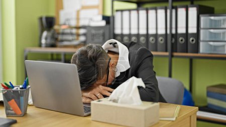 Photo for Young beautiful hispanic woman business worker being sick using napkin at office - Royalty Free Image