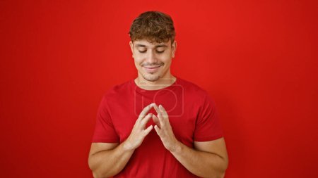 Photo for Young hispanic man smiling confident with hands together over isolated red background - Royalty Free Image